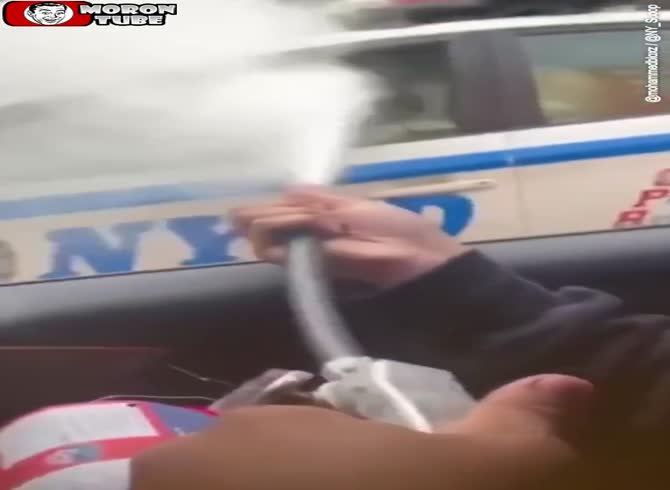 Video :A police officer is stunningly attacked as masked thugs spray an NYPD cop with a fire extinguisher